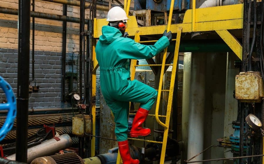 Technician working at an industrial oil and gas facility
